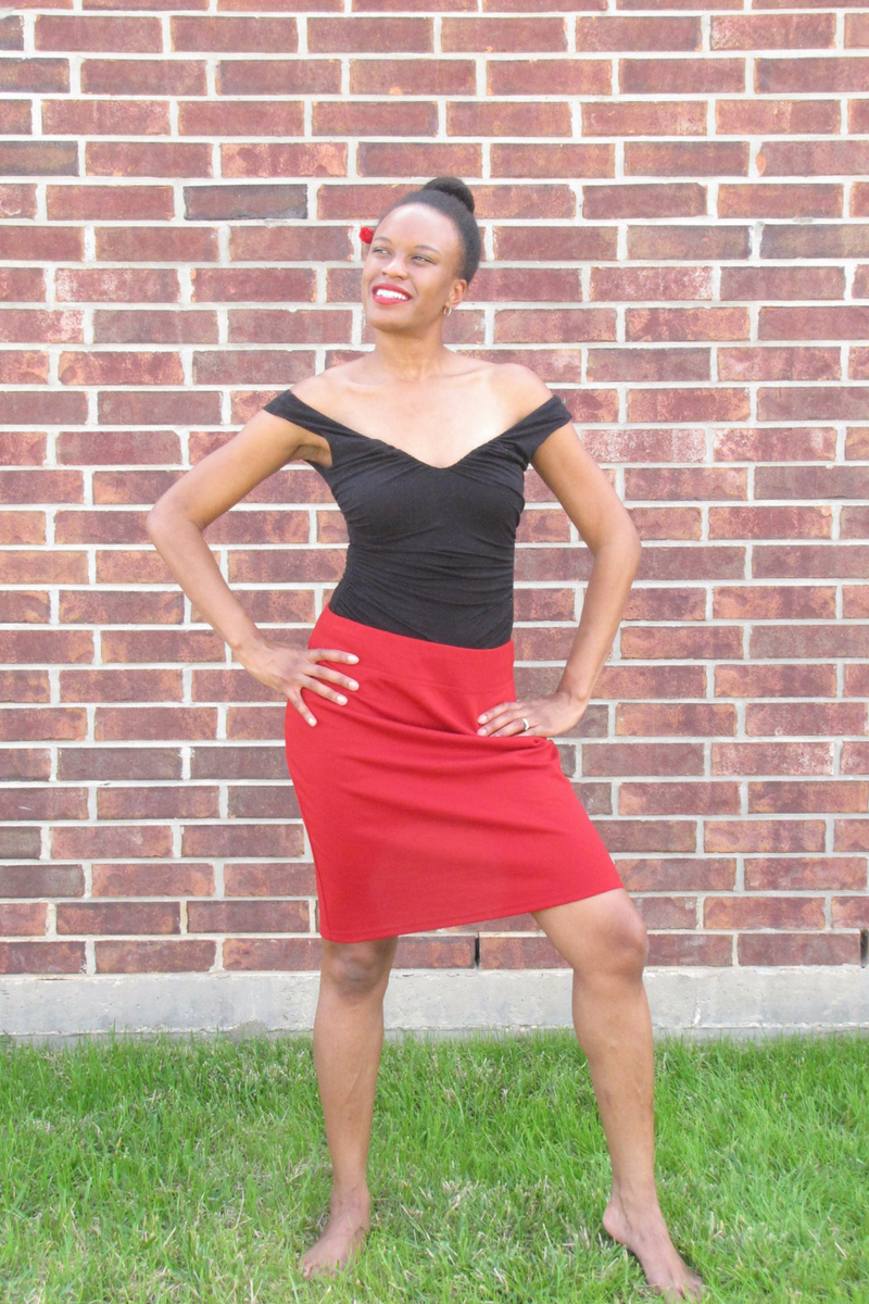 black sleeveless top and red skirt 