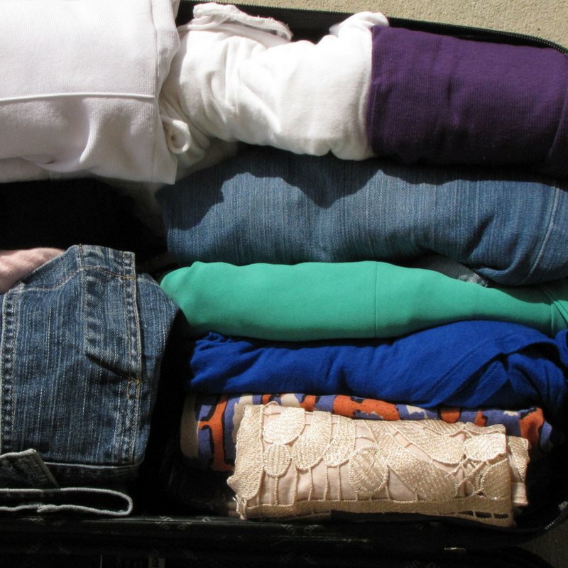 clothes rolled up in the luggage 